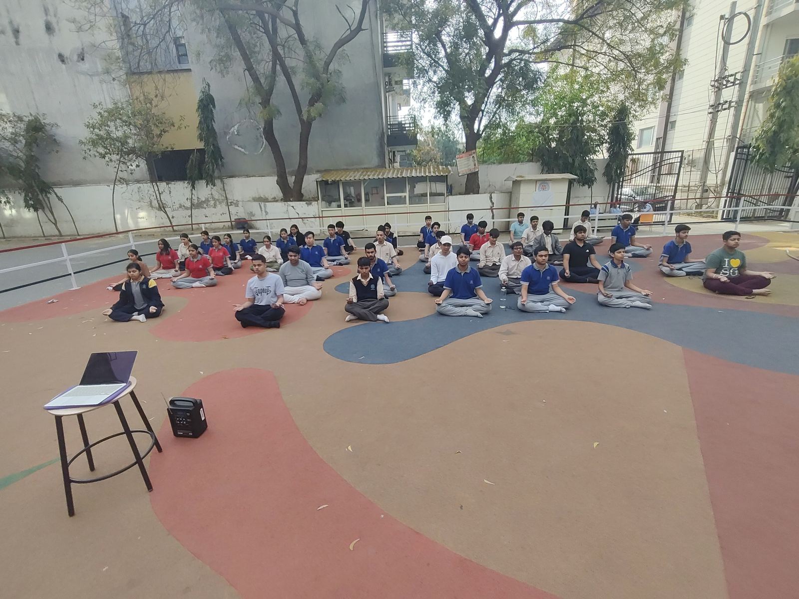 Outdoor meditation session with school students
