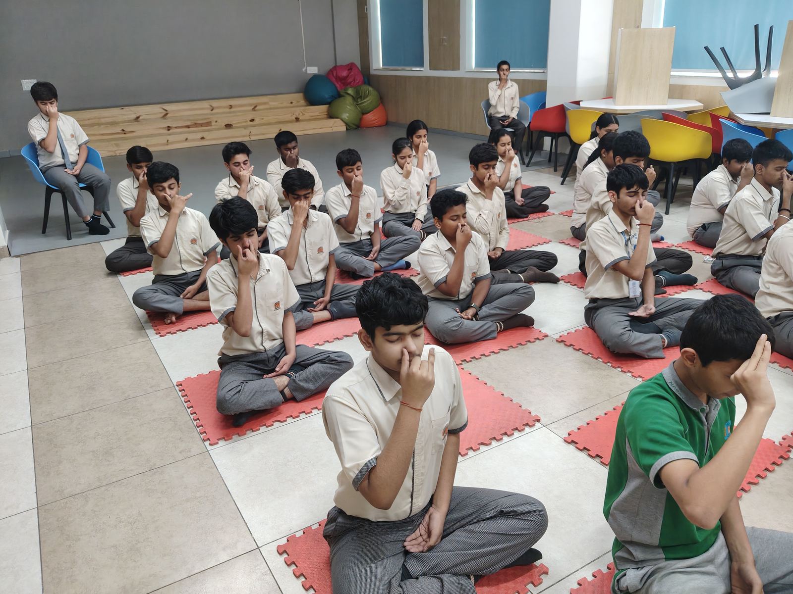 Students practising alternate-nostril breathing